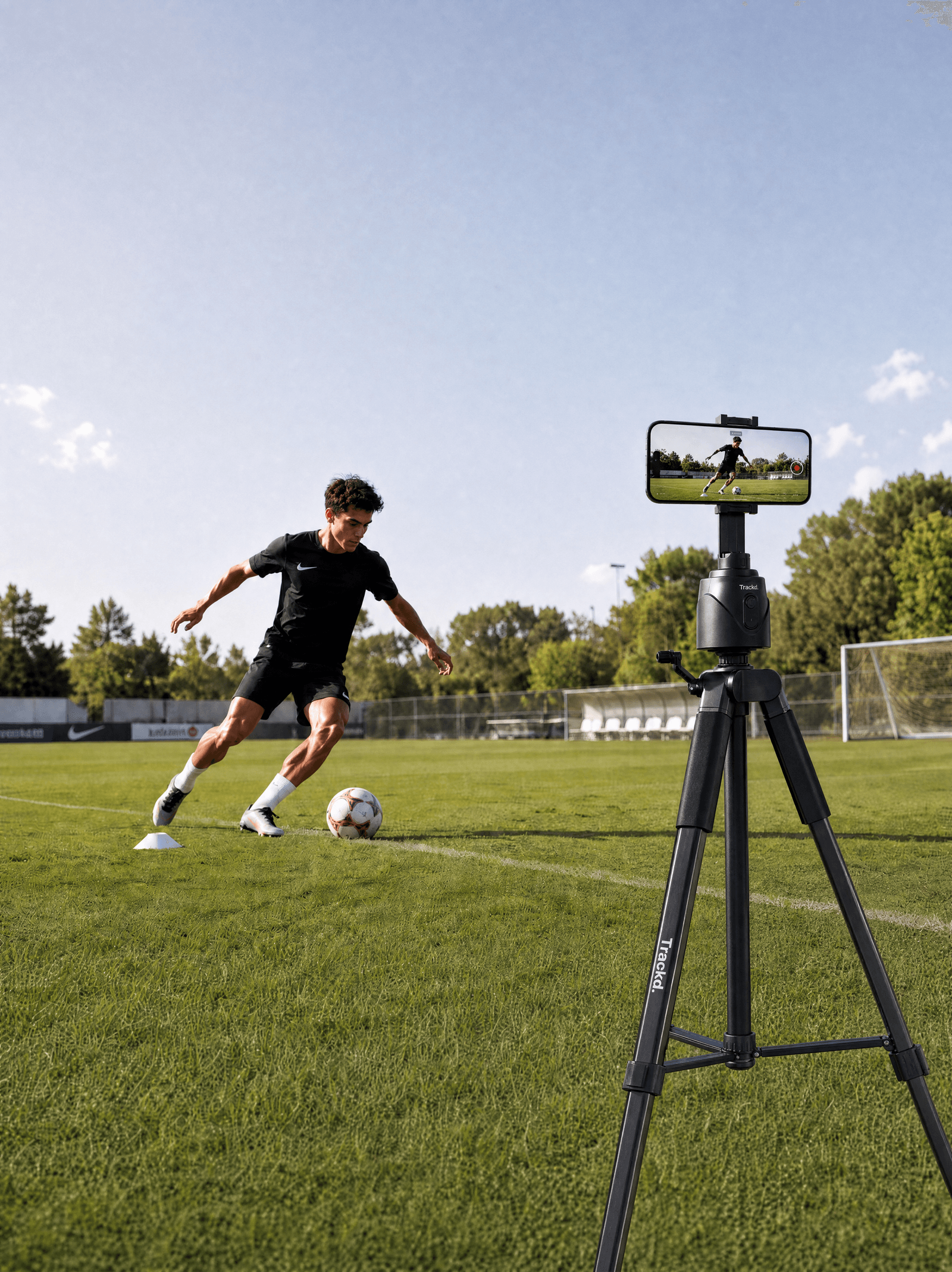 Trackd auto-tracking a footballer on a sunny field